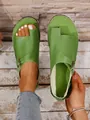 Macro detail of casual green leather toe-loop sandals with adjustable flat buckle strap - Green