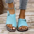 Close-up of light blue flat toe-ring sandals with metal buckles on feet - 35 / Sky Blue