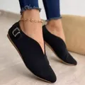 Detail showing the side buckle and pointed toe of black V-cut suede flat shoes - 35 / Black