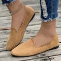 Close-up detail of women's casual camel suede flat loafers with comfortable slip-on design - 36 / Camel