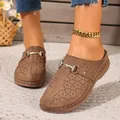 Detailed view of stylish brown hollow closed-toe platform mules with metal buckle accent - 36 / Brown