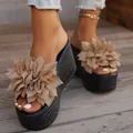 Detail view of stylish wedge platform sandals with large fabric flower decoration. - 34 / Milk Tea