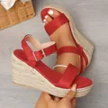 Detailed view of red suede espadrille wedge sandals featuring a rope-wrapped platform - 38 / Red
