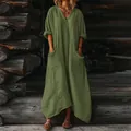 Detail view of a loose olive green maxi dress with large front pockets and V-neck. - S / Dresses / Army Green