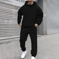 Detailed view of a minimalist black fleece hoodie and joggers tracksuit set on a model - S / Top And Bottom / Black
