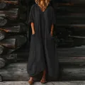 Detailed view of women's loose bohemian maxi dress with pockets in black. - S / Dresses / Black