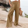 Detail of brown cotton linen wide-leg pants with smocked high waist and button pocket - Camel
