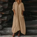 Full view of bohemian solid maxi dress with pockets in a rustic log cabin environment - S / Dresses / Khaki