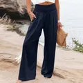 Detail view of women's navy blue wide-leg cotton linen trousers with smocked high waist - Navy Blue