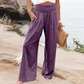 Detailed macro shot of purple high-waisted cotton linen wide-leg trousers for summer - Purple
