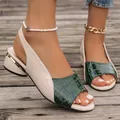 Close-up of color-blocked block heel sandals with green croc-textured peep-toe design - Green