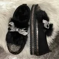 Close-up view of elegant black loafers with fluffy faux fur and sparkling rhinestone bows - 44 / Bow Rhinestone Style (69464) / Black