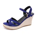 Close-up of blue suede crossover strap wedge sandals featuring gold buckle charm - 38 / Cross Strap Wedge Sandals (001) / Blue