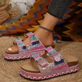 Detail view of pink rhinestone platform slippers with cork sole and double buckles. - 36 / Red
