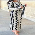 Full-length view of a slim-fit knit dress with bold black and white wavy print - S / Dresses / White Wave
