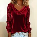 Detailed view of red velvet top featuring a draped cowl neck and sequined sleeves - S / Tops / Red