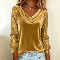 Detail of golden velvet top with sequin patchwork sleeves and draped cowl neck - Gold