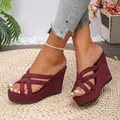 Close-up detail of stylish burgundy suede wedge sandals with crossover straps - 35 / Burgundy