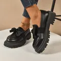 Stylish black platform loafers with a large bow, chunky lug sole for women. - Black Matte