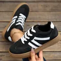 Retro black and white women's sneakers featuring a classic gum sole and lace-up design - 36 / Black