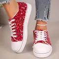 Close-up view of stylish red sequined casual canvas sneakers with white laces and sole - 36 / Red