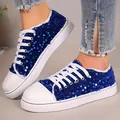 Detailed view of blue sequined sneakers featuring white laces and cozy plush lining - 36 / Blue