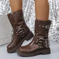 Close-up detail of stylish brown chunky heel western boots featuring metal buckles - 35 / Brown