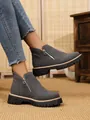 Detailed view of grey suede ankle boots with side zipper and chunky lug sole - 36 / Gray