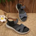 Comfortable black women's flat sandals with woven blue cross straps and velcro closure - 36 / Black