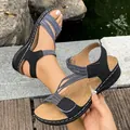 Detail view of women's sports sandals showing striped elastic straps and velcro closure - 36 / Black