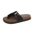 Detailed view of women's black and brown platform slide with golden buckle detail. - 36 / Black