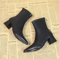 Elegant black pointed-toe high heel ankle boots for women displayed on newspaper - 35 / Fleece Lining / Black