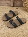 Black flat sandals for women featuring buckle straps and a textured cork sole - 35 / Black