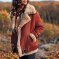 Close-up of a women's brown suede shearling jacket featuring thick wool lining and buckle details - S / Tops / Red