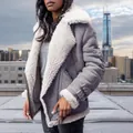 Detail of a grey faux suede shearling aviator jacket on a model in an urban setting - S / Tops / Gray