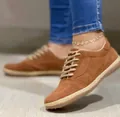 Detailed view of brown suede lace-up flat shoes with braided sole trim for women - Brown / 35