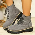 Detailed close-up of stylish grey suede lace-up platform ankle boots with thick soles - 36 / Gray