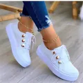 Stylish white platform sneakers with gold button accents for casual women's wear - 35 / White