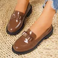 Detailed view of women's brown patent leather loafers featuring thick soles and a bow accent - Brown Bowknot