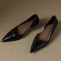 Side view showing elegant black pointed-toe kitten heel pumps for professional wear. - 35 / Black