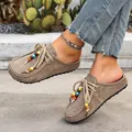 Taupe suede platform clogs for women featuring colorful beaded laces and soft texture - 36 / Khaki