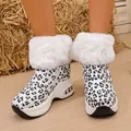 Stylish leopard print snow boots featuring white faux fur trim and platform sole. - White Leopard