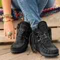 Detailed view of black suede fringe ankle boots featuring western style and moccasin stitching - 35 / Black