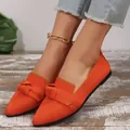 Close-up view of bright orange flyknit pointed toe flats featuring a knitted bow detail - 36 / Orange Red