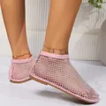 Close-up of pink mesh flat ankle boots featuring sparkling rhinestone embellishments - 35 / Pink