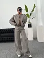 Full body view of a woman wearing a taupe zip-up sweatshirt and wide-leg pants set - S / Top And Bottom / Khaki