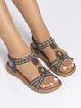 Detailed view of bohemian flat sandals with ethnic beaded straps and braided accents. - 36 / Navy Blue