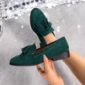 Elegant dark green suede loafers with stylish tassel detail and comfortable flat sole - 36 / Malachite green