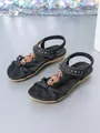 Detail view of black bohemian flat sandals with beaded flowers and sparkling rhinestones - 36 / Black