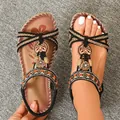 Handgefertigte flache Bohème-Sandalen mit schwarzen Perlenriemen und Schmetterlingen - 38 / Naturschwarz